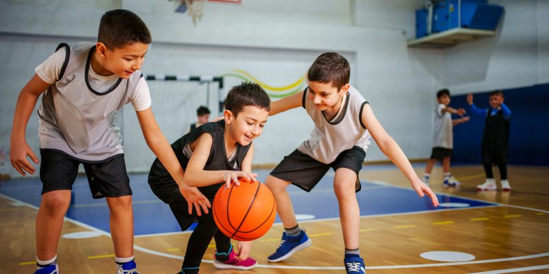 Junior basketball team is practicing game at indoor court
